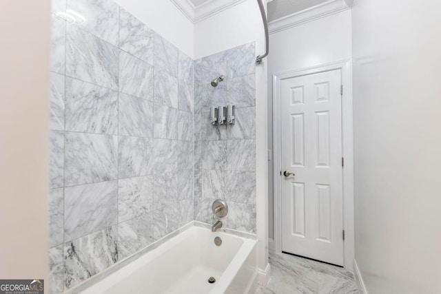 bathroom with tiled shower / bath combo and crown molding