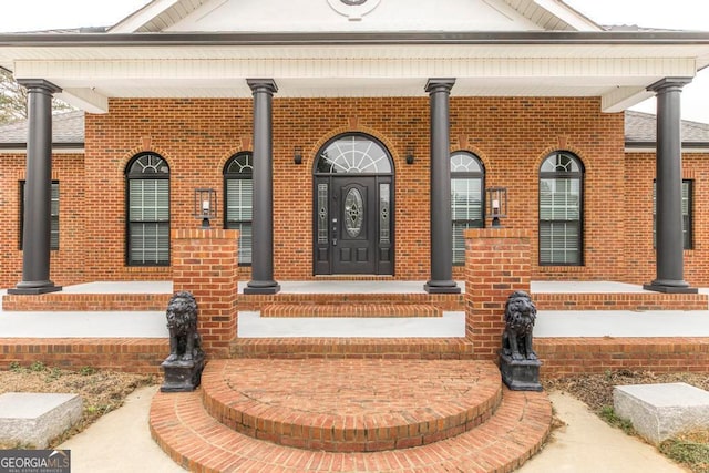 entrance to property with covered porch