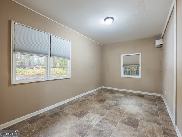 spare room with a wall mounted air conditioner