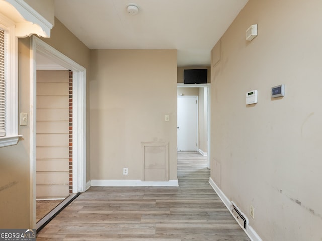 corridor featuring light hardwood / wood-style flooring