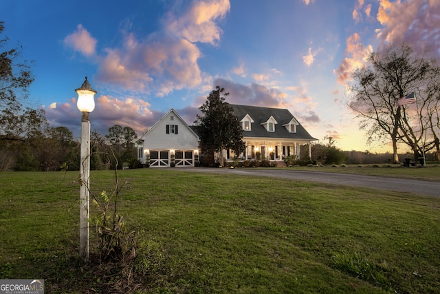 new england style home with a yard