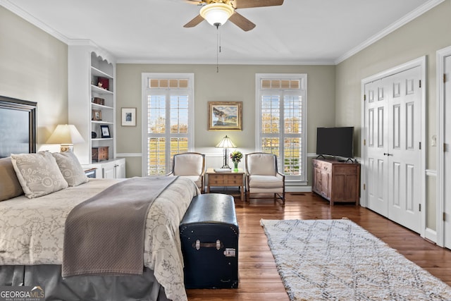 bedroom with multiple windows, crown molding, dark hardwood / wood-style floors, and ceiling fan