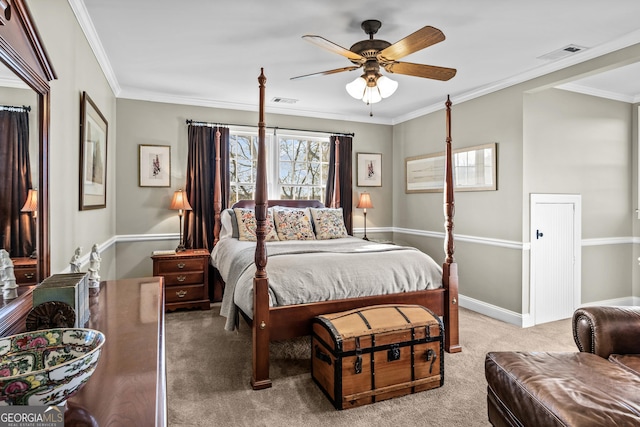 carpeted bedroom featuring crown molding and ceiling fan