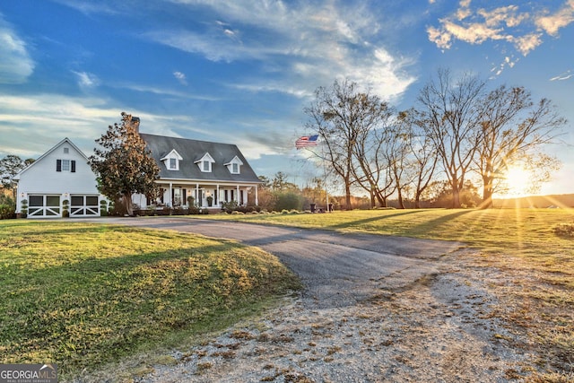 view of front of house featuring a front lawn and covered porch