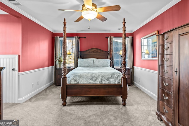 bedroom featuring multiple windows, ornamental molding, and light carpet