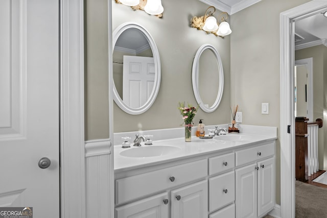 bathroom featuring ornamental molding and vanity