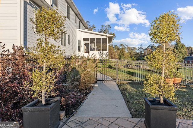 view of yard with a sunroom