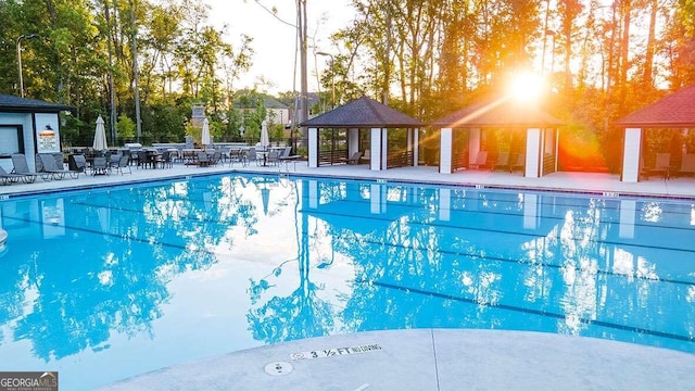 view of swimming pool featuring a gazebo and a patio area