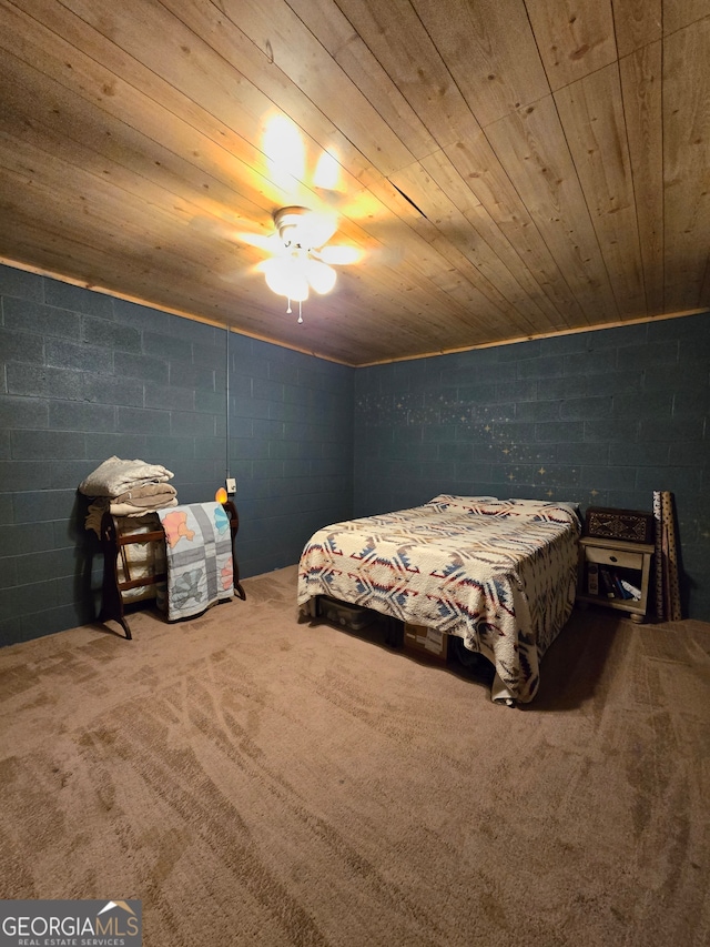 carpeted bedroom with ceiling fan and wooden ceiling