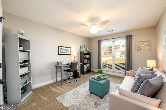 office space with ceiling fan and light colored carpet