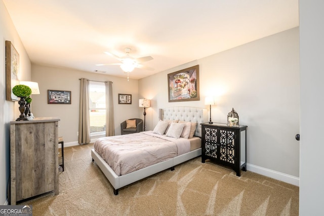 bedroom featuring light carpet and ceiling fan