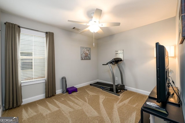 workout room featuring carpet floors and ceiling fan