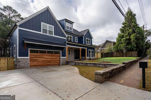 view of front of house featuring a garage and a front yard