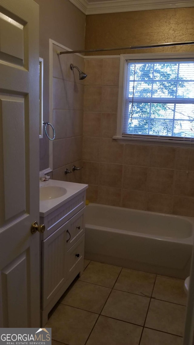 bathroom featuring tile patterned floors, a healthy amount of sunlight, and ornamental molding