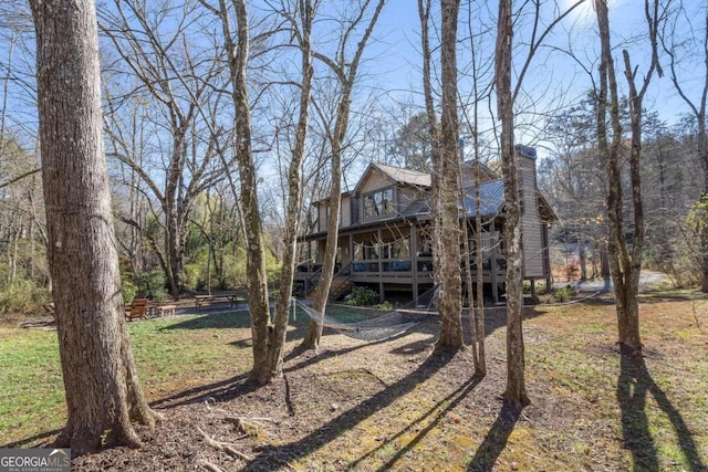 view of yard featuring a wooden deck