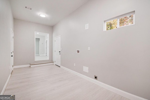 unfurnished room featuring light wood-type flooring