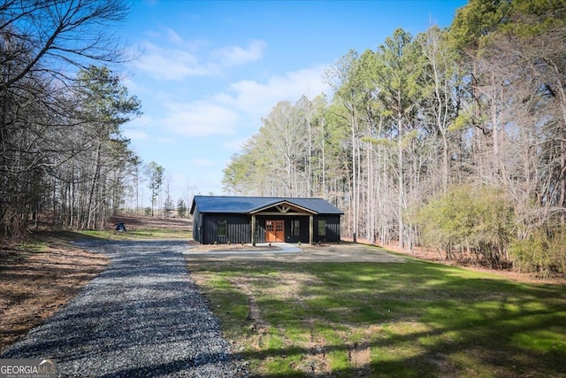 view of outdoor structure with a yard