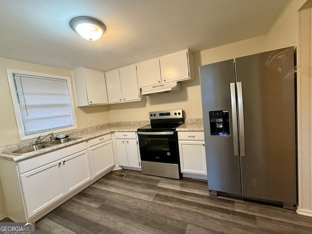 kitchen featuring white cabinetry, sink, stainless steel appliances, light stone counters, and dark hardwood / wood-style floors