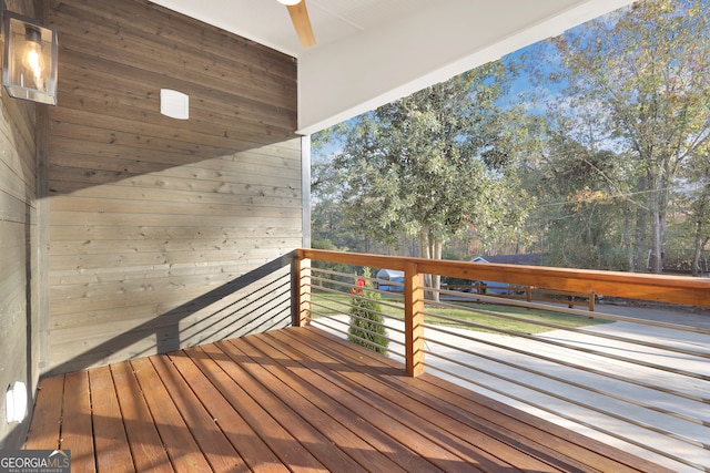 wooden deck with ceiling fan