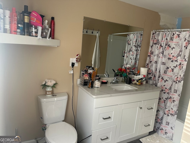 bathroom with vanity and toilet