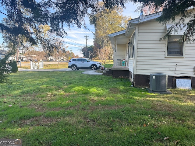 view of yard featuring central AC