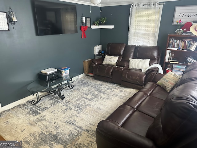 living room featuring ceiling fan and ornamental molding