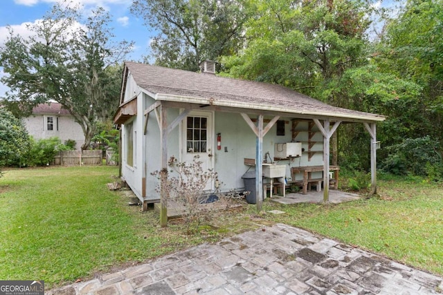 view of outdoor structure with a lawn