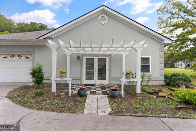 view of front of property featuring a pergola and a garage