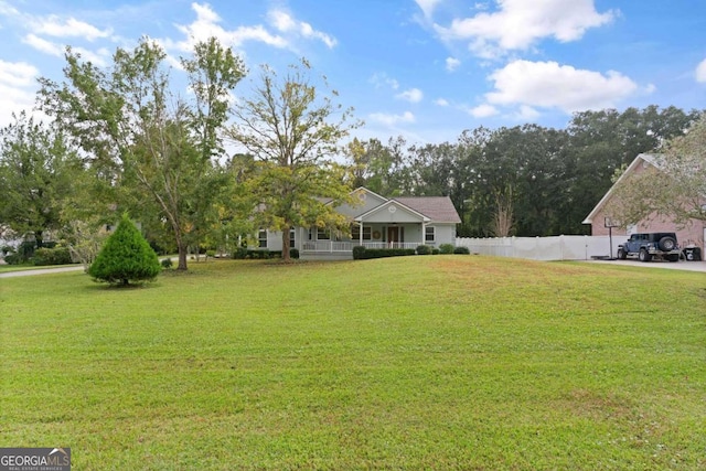 view of front of home with a front lawn and a porch