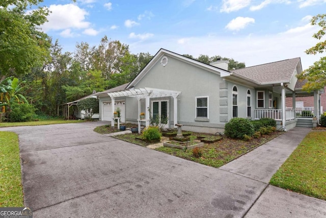 view of front facade with a garage and covered porch