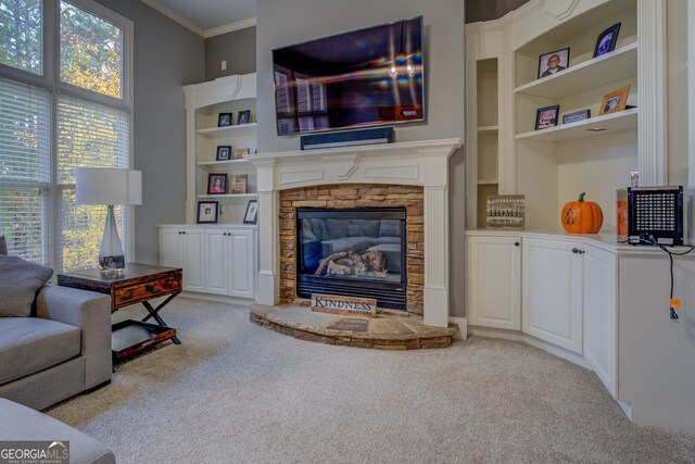 carpeted living room featuring crown molding, a fireplace, and built in features