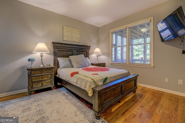 bedroom featuring wood-type flooring