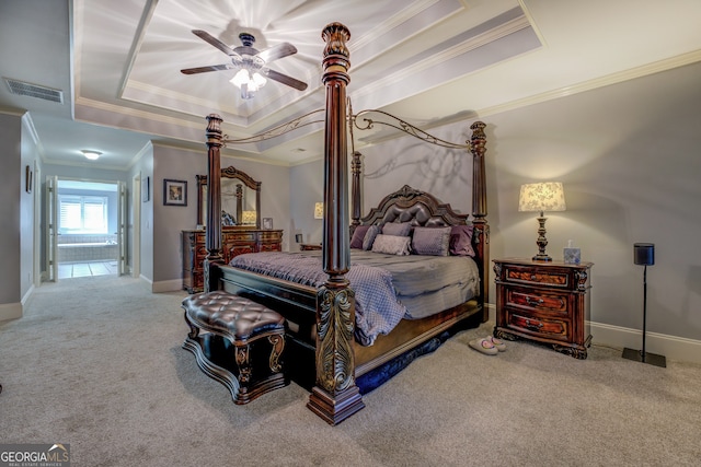 carpeted bedroom featuring a raised ceiling, ceiling fan, and crown molding