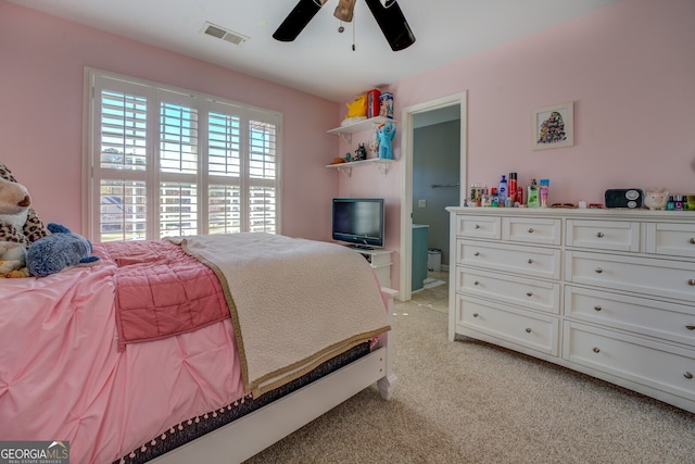 bedroom featuring light carpet and ceiling fan