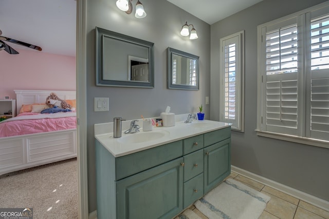 bathroom featuring tile patterned flooring, vanity, and ceiling fan