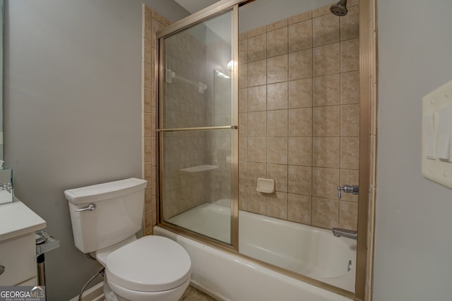 full bathroom with vanity, toilet, and shower / bath combination with glass door