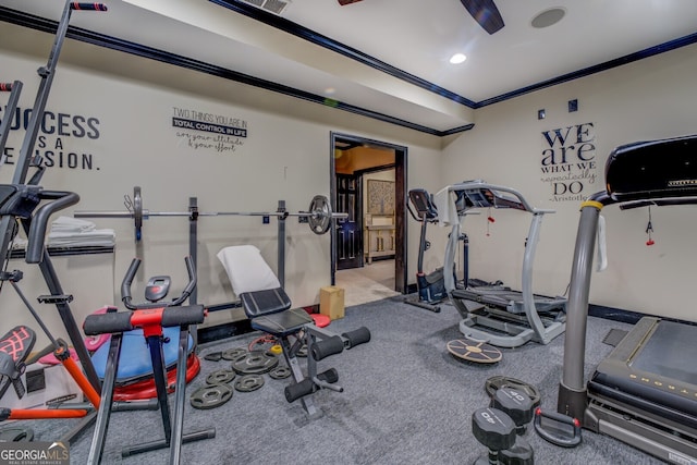 exercise area featuring carpet and crown molding