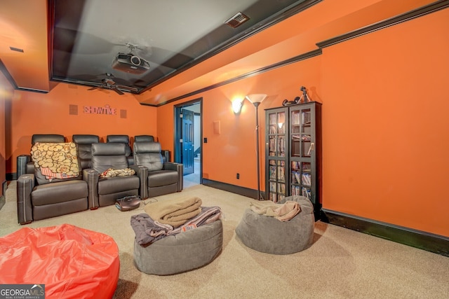 home theater room with carpet flooring and ceiling fan