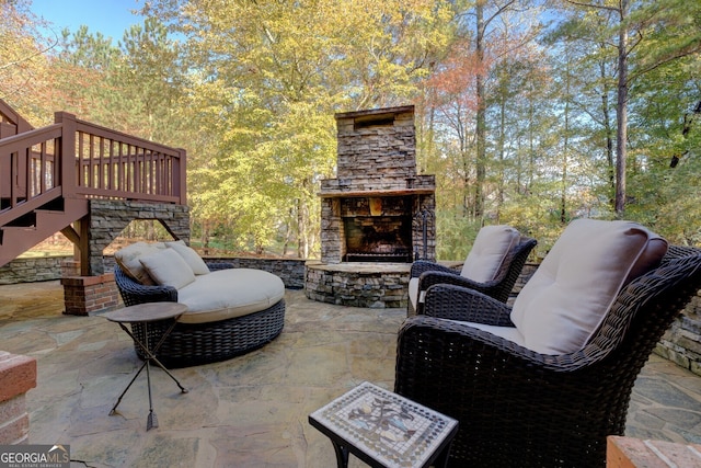 view of patio / terrace with an outdoor stone fireplace