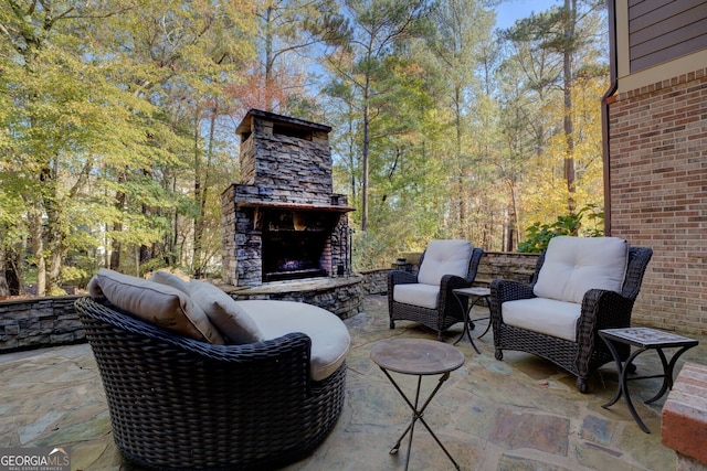 view of patio / terrace with an outdoor stone fireplace