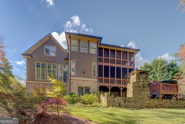 rear view of property featuring a yard