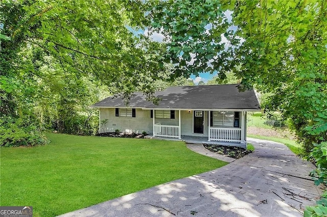 ranch-style home with a porch and a front lawn