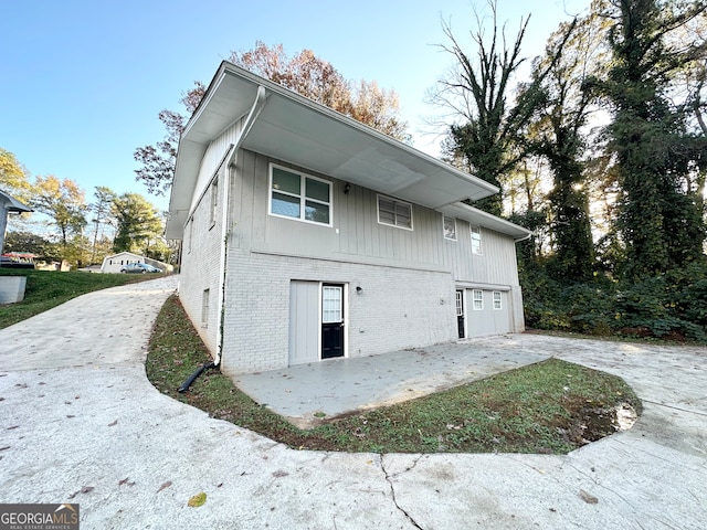 view of property exterior with a patio