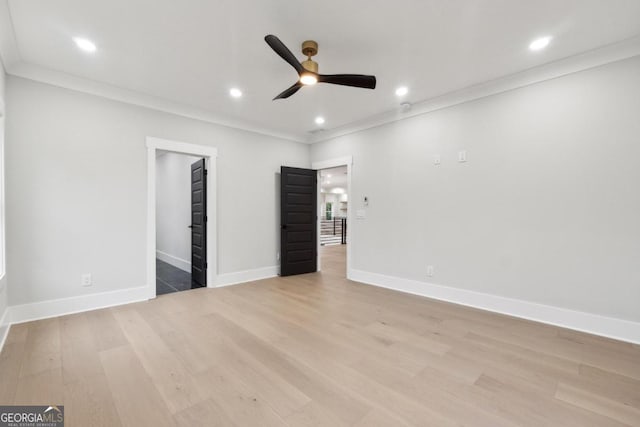 unfurnished bedroom featuring ceiling fan, light hardwood / wood-style floors, and ornamental molding