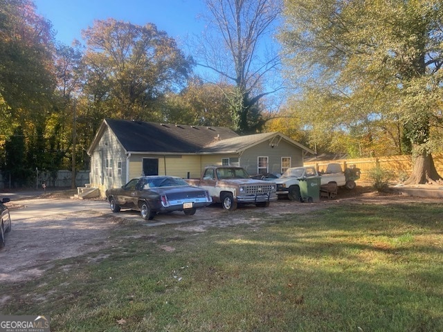 view of side of home featuring a yard