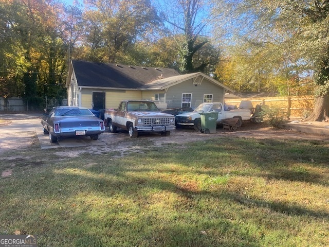 view of side of home featuring a yard