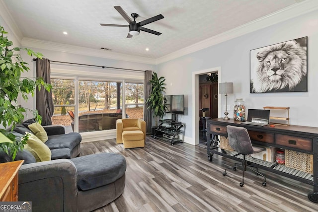 home office with ceiling fan, ornamental molding, a textured ceiling, and hardwood / wood-style flooring