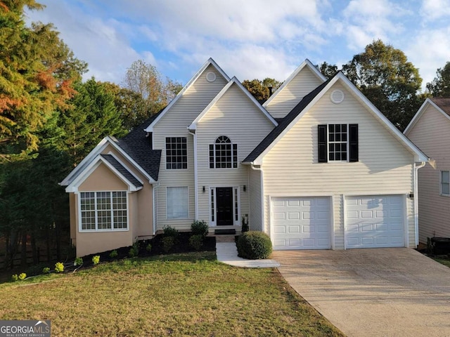 front of property with a garage and a front lawn