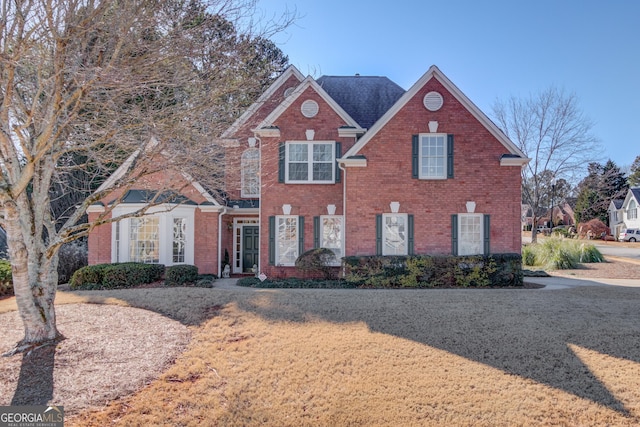 view of front of house with brick siding