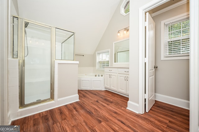 bathroom with plus walk in shower, wood-type flooring, and lofted ceiling